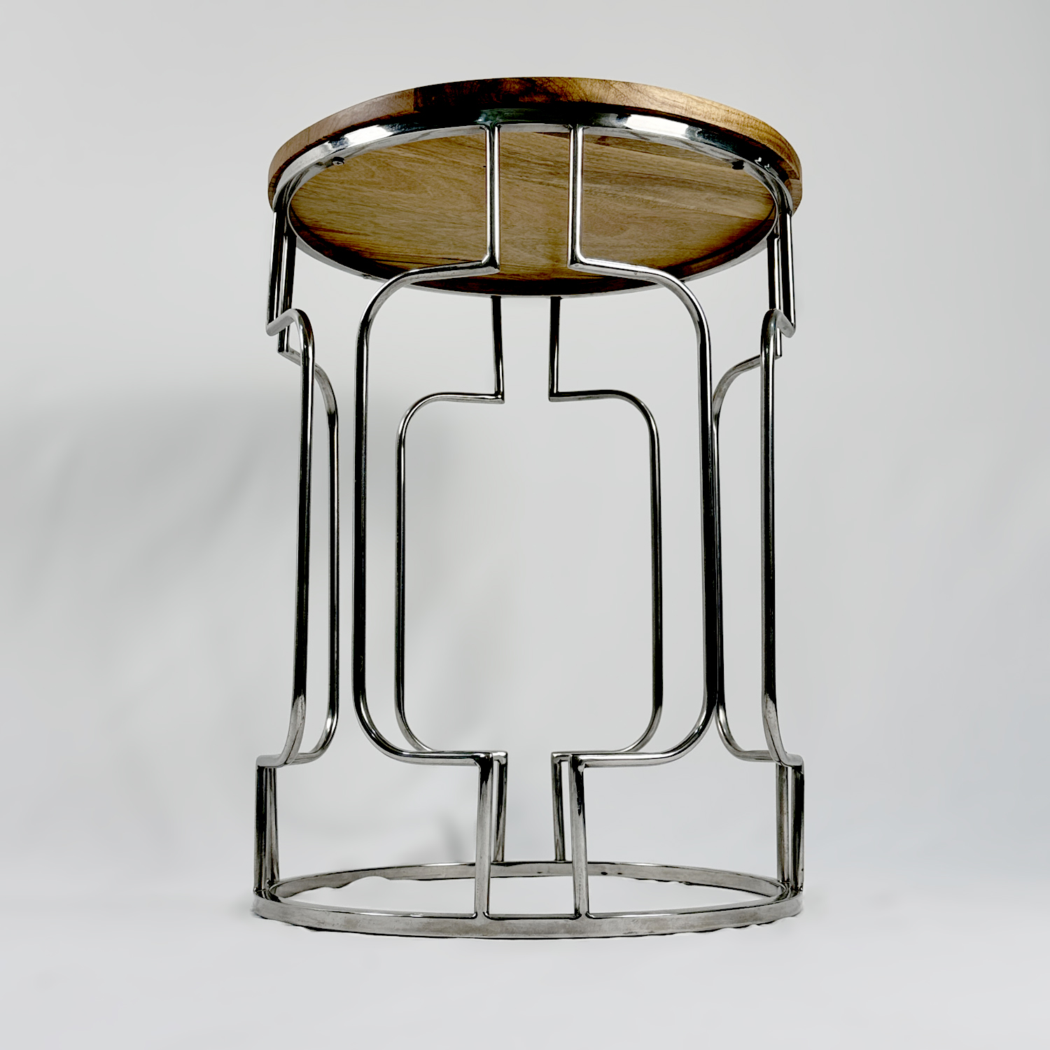 طاولة مستديرة بتفاصيل منحنية من الفولاذ